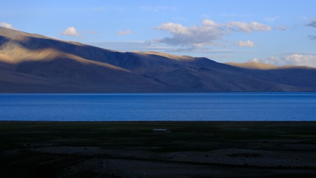 A large body of water surrounded by mountains